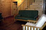 Log Cabin Rental Photos - Living Room Looking Toward One Bedroom and the Stairs - North Country Rivers